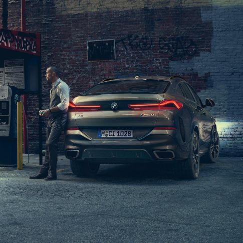 BMW X6 rear. BMW X6 in rear perspective in front of an urban setting.