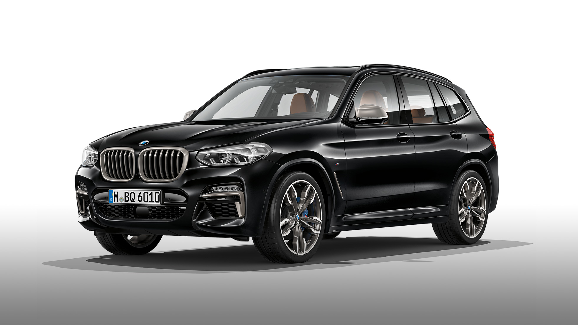 BMW X3 M40i and BMW X3 M40d, side view. BMW X3 M40i and BMW X3 M40d in Black Sapphire metallic, exterior, side view.