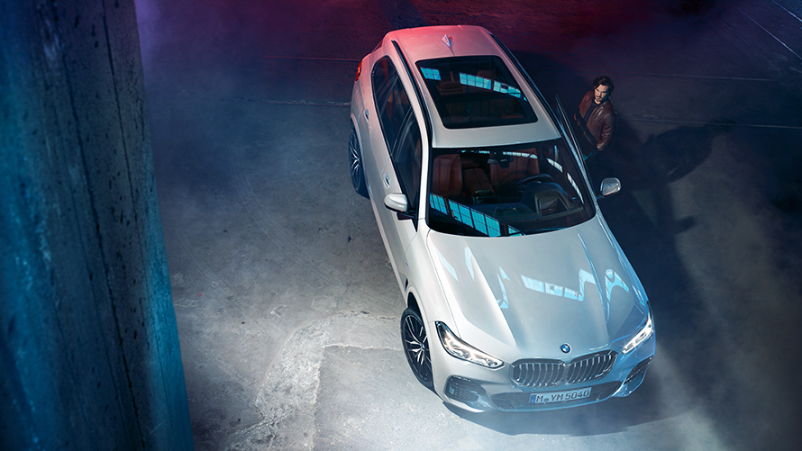 Night-time shot of the BMW X5 from above in an urban setting