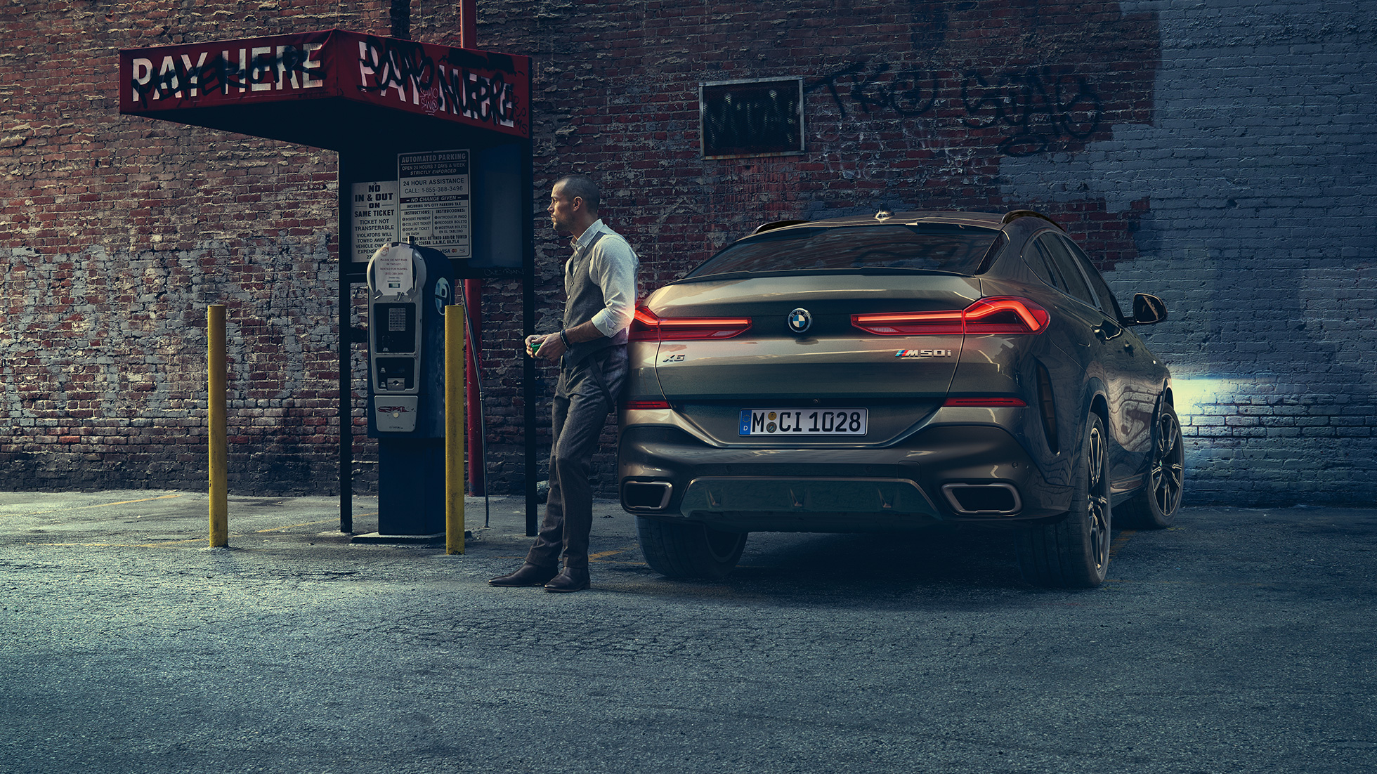 BMW X6 rear. BMW X6 in rear perspective in front of an urban setting.