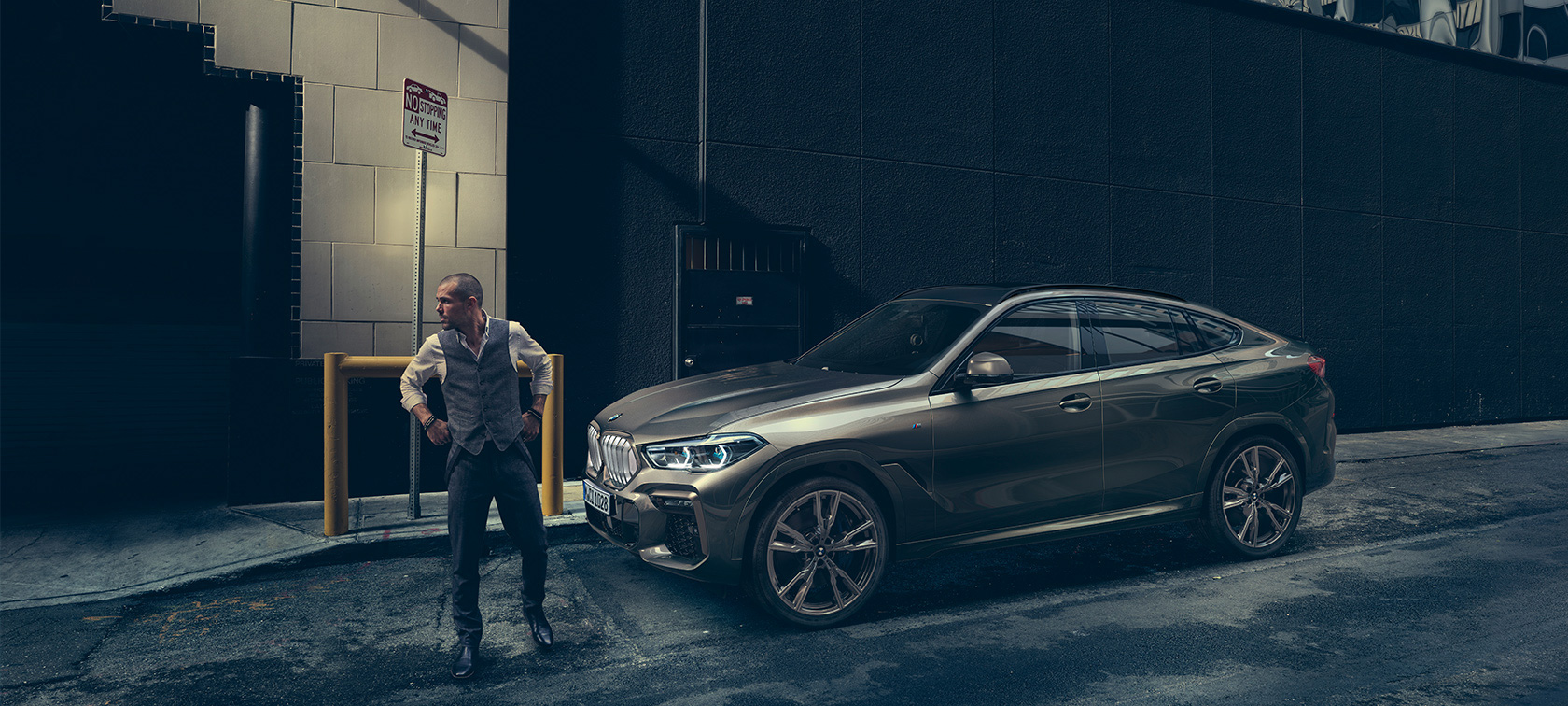 BMW X6. BMW X6 in lateral perspective in front of an urban setting.